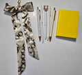Sunshine Yellow Bundle — 5 pens, mini notebook, and chain-print bag scarf in yellow and cream tones