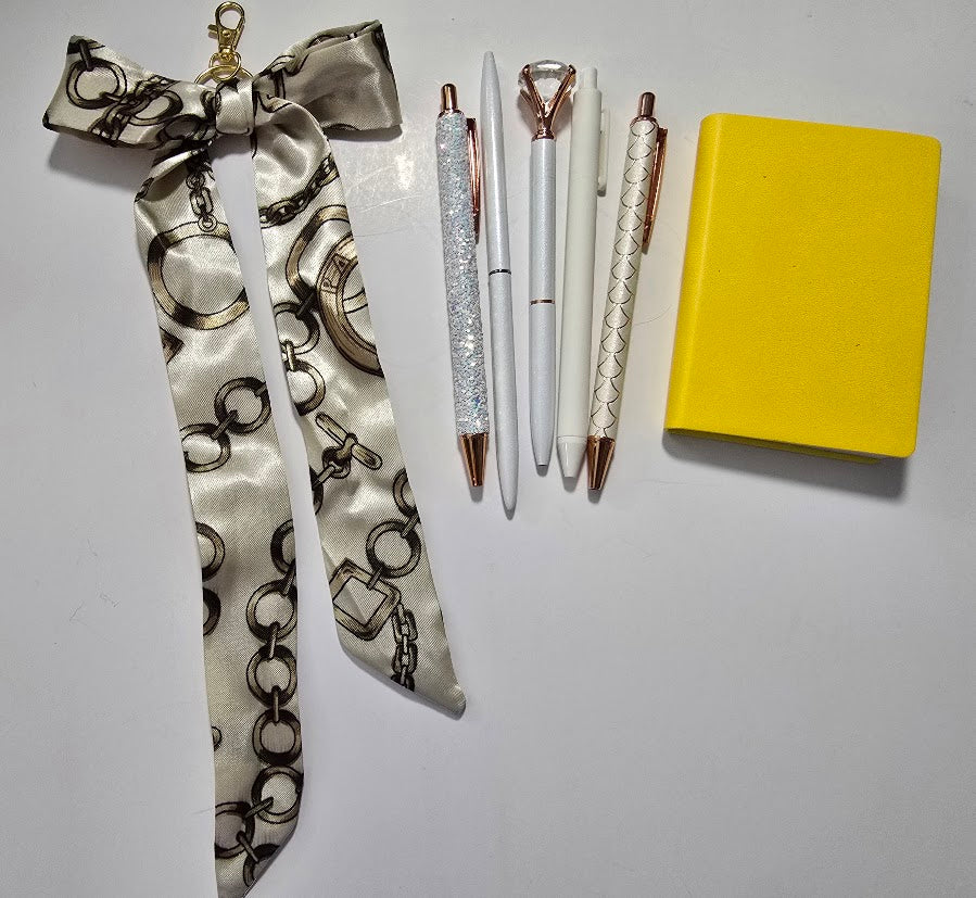 Sunshine Yellow Bundle — 5 pens, mini notebook, and chain-print bag scarf in yellow and cream tones