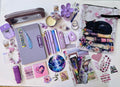 Periwinkle Dreams Bookish Bundle flat lay with purple and lavender accessories including journal, pens, stickers, bookmarks, and more