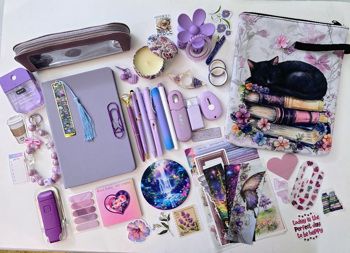 Periwinkle Dreams Bookish Bundle flat lay with purple and lavender accessories including journal, pens, stickers, bookmarks, and more